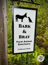 Load image into Gallery viewer, Sign for Bark & Bray Farm Animal Sanctuary with donkey and dog silhouettes against a green leafy background. Sign by God & Country Workshop, in New Hampshire.