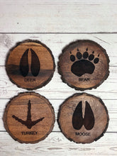 Load image into Gallery viewer, set of 4 round wildlife tracks-themed Acacia wood coasters.
